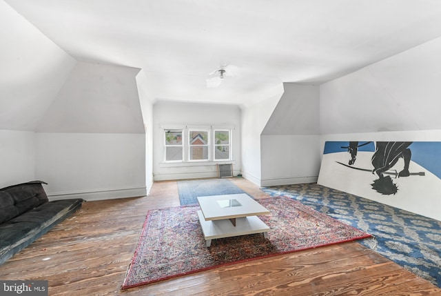 714 W St, Laurel, DE 19956 - living room with vaulted ceiling, wood finished floors, and baseboards
