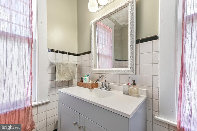 714 W St, Laurel, DE 19956 - bathroom featuring tile walls and vanity