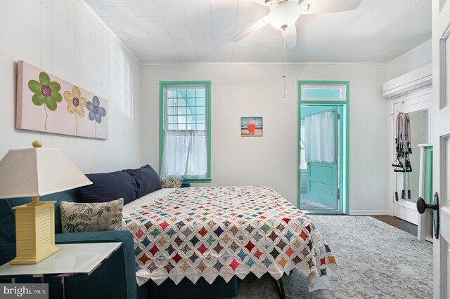 714 W St, Laurel, DE 19956 - bedroom featuring ornamental molding, an AC wall unit, ceiling fan, and wood finished floors