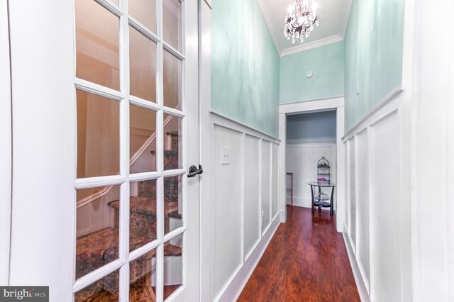 714 W St, Laurel, DE 19956 - corridor with ornamental molding, a chandelier, and dark wood-style flooring