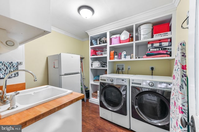 714 W St, Laurel, DE 19956 - laundry room featuring ornamental molding, washer and dryer, and dark wood-style floors