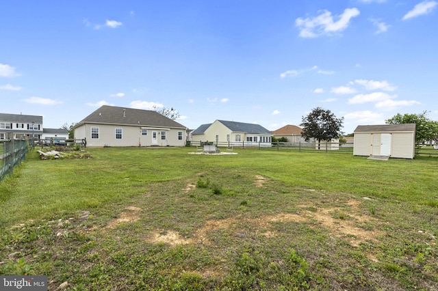 view of yard with a storage shed and an outdoor structure