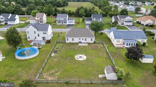 aerial view of residential area featuring a pool
