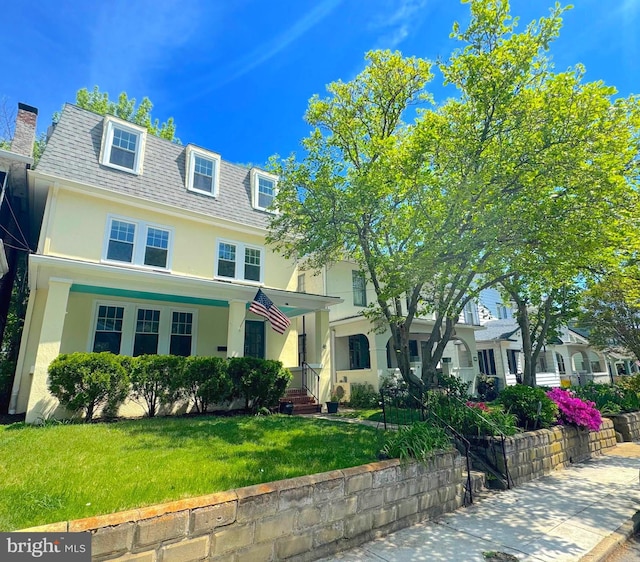 46 Murray Ave, Annapolis, MD 21401 - view of front of home featuring mansard roof, stucco siding, a front yard, and a shingled roof