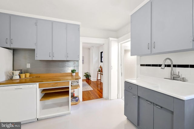 46 Murray Ave, Annapolis, MD 21401 - kitchen with gray cabinets, dishwasher, tasteful backsplash, a sink, and light countertops
