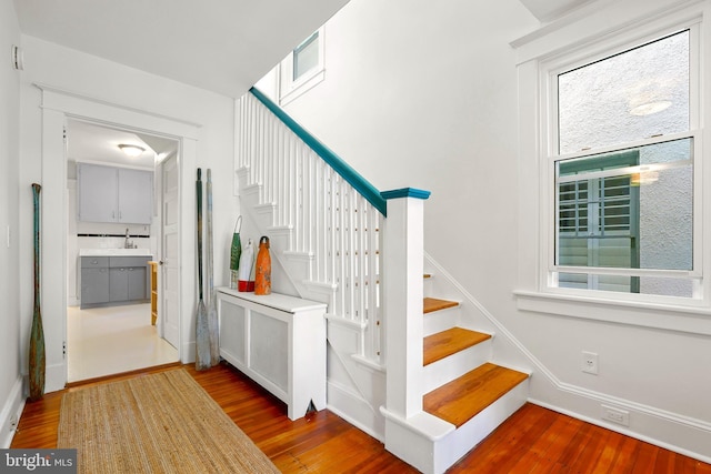 46 Murray Ave, Annapolis, MD 21401 - staircase featuring wood finished floors, plenty of natural light, and baseboards
