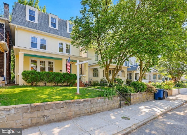 46 Murray Ave, Annapolis, MD 21401 - view of front of home featuring a shingled roof, mansard roof, stucco siding, and a front yard