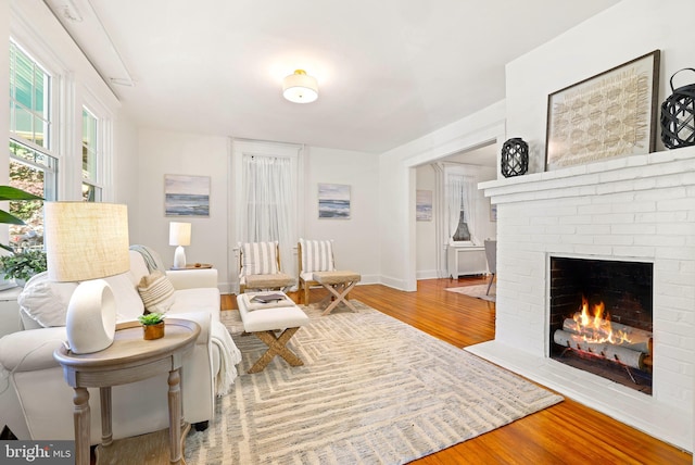 46 Murray Ave, Annapolis, MD 21401 - living area with wood finished floors, a fireplace, and baseboards