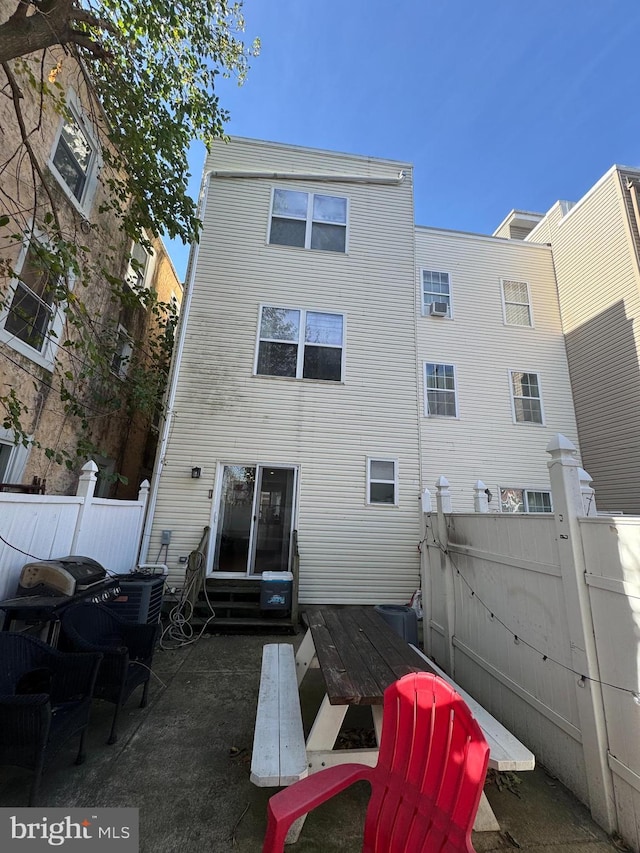 641 N 12th St, Philadelphia, PA 19123 - back of house featuring fence, entry steps, and a gate
