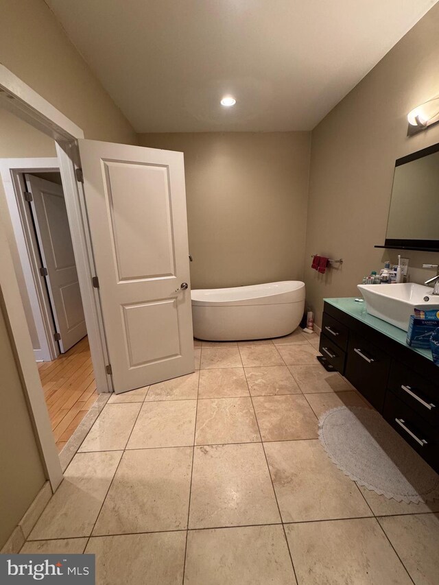 641 N 12th St, Philadelphia, PA 19123 - full bath with vanity, a soaking tub, tile patterned floors, and recessed lighting