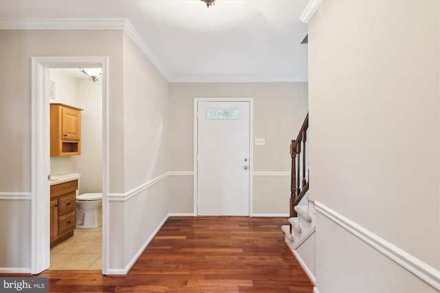 10007 Marshall Pond Rd, Burke, VA 22015 - entrance foyer featuring light wood finished floors, stairs, ornamental molding, and baseboards