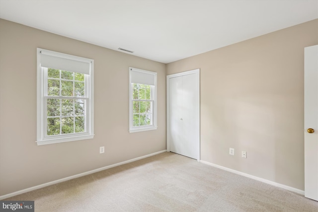 10007 Marshall Pond Rd, Burke, VA 22015 - unfurnished bedroom with baseboards, carpet flooring, and a closet