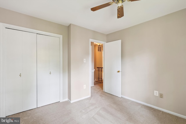 10007 Marshall Pond Rd, Burke, VA 22015 - unfurnished bedroom with light colored carpet, baseboards, a closet, and ceiling fan