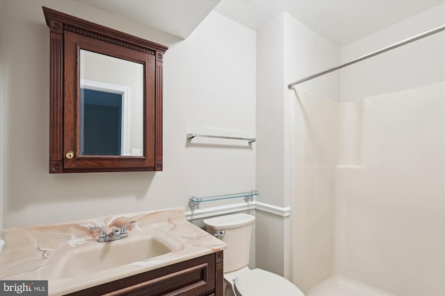 10007 Marshall Pond Rd, Burke, VA 22015 - full bath with a stall shower, toilet, and vanity