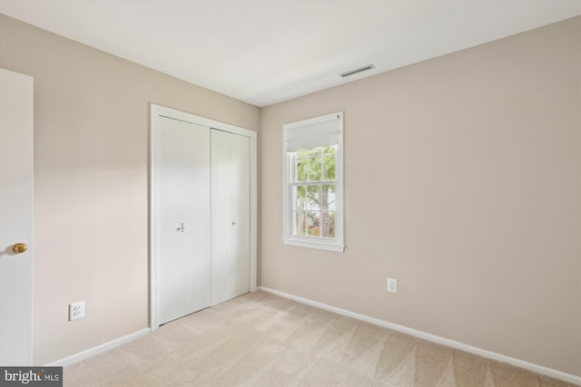 10007 Marshall Pond Rd, Burke, VA 22015 - unfurnished bedroom with light carpet, a closet, and baseboards