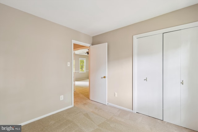 10007 Marshall Pond Rd, Burke, VA 22015 - unfurnished bedroom with light carpet, baseboards, and a closet