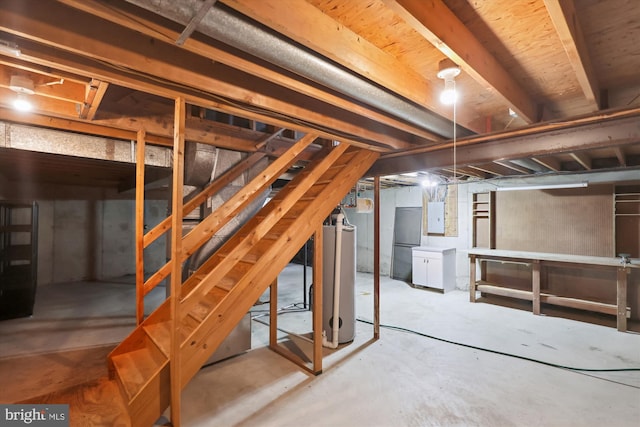 10007 Marshall Pond Rd, Burke, VA 22015 - unfinished below grade area with electric panel, stairway, and freestanding refrigerator