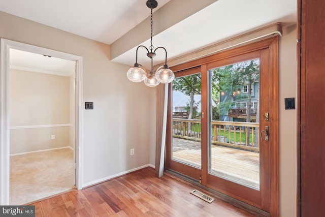 10007 Marshall Pond Rd, Burke, VA 22015 - unfurnished dining area with light wood finished floors, baseboards, crown molding, and a chandelier