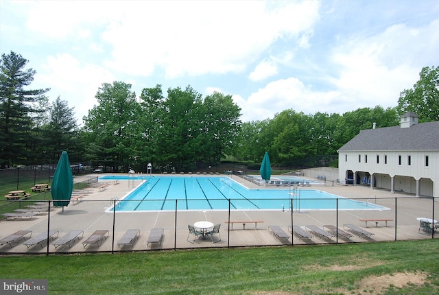 10007 Marshall Pond Rd, Burke, VA 22015 - community pool featuring a patio area and view of scattered trees