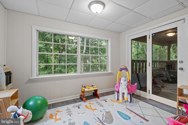 2020 Valley View Dr, Folcroft, PA 19032 - playroom featuring tile patterned flooring, plenty of natural light, baseboards, heating unit, and a paneled ceiling