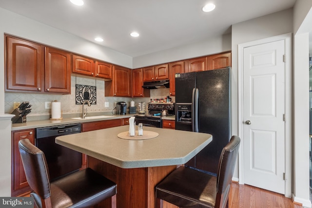 7163 Deep Falls Way Unit 139, Elkridge, MD 21075 - kitchen featuring black appliances, a sink, light countertops, a kitchen bar, and recessed lighting