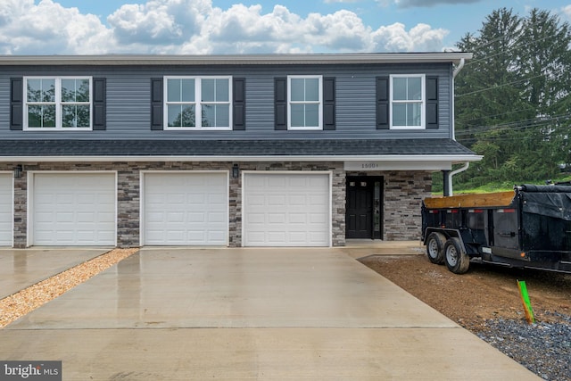 1500A Embassy, Harrisburg, PA 17109 - view of property with a garage and driveway