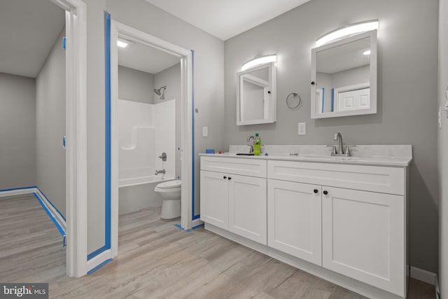 1500A Embassy, Harrisburg, PA 17109 - bathroom with double vanity, wood finished floors, toilet, tub / shower combination, and baseboards