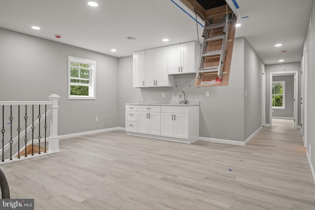 1500A Embassy, Harrisburg, PA 17109 - kitchen featuring baseboards, plenty of natural light, white cabinets, light wood-style flooring, and recessed lighting