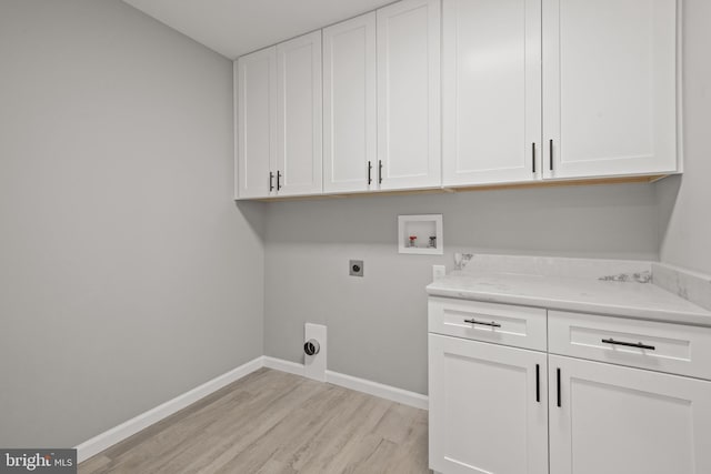 1500A Embassy, Harrisburg, PA 17109 - laundry room featuring electric dryer hookup, cabinet space, washer hookup, light wood finished floors, and baseboards