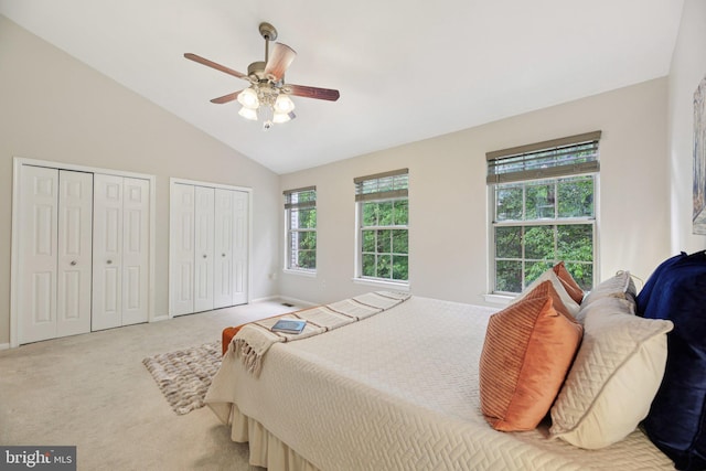14321 Long Channel Dr, Germantown, MD 20874 - bedroom with carpet floors, multiple closets, lofted ceiling, and a ceiling fan