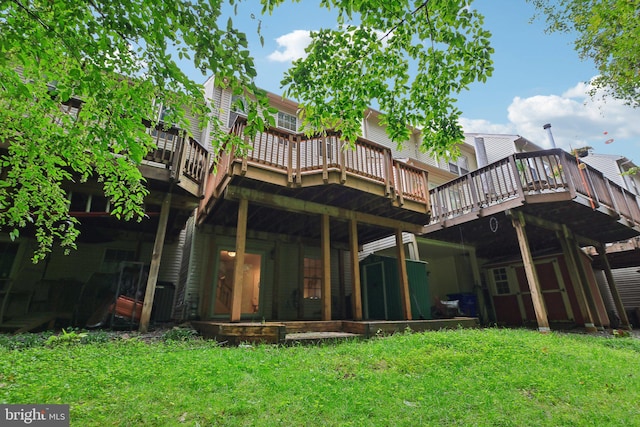 14321 Long Channel Dr, Germantown, MD 20874 - rear view of house with a deck and a lawn