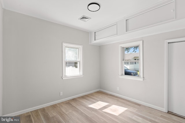 341 Ives Ave, Penns Grove, NJ 08069 - unfurnished bedroom featuring multiple windows, light wood-style flooring, and baseboards