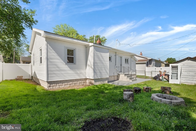 341 Ives Ave, Penns Grove, NJ 08069 - back of house featuring a fire pit, entry steps, and a chimney
