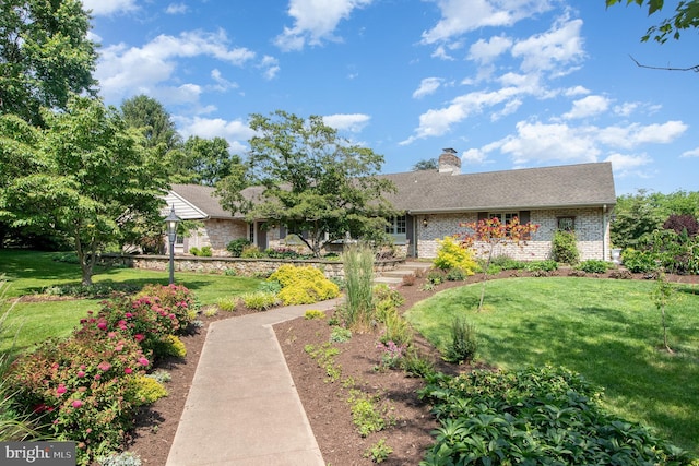 4 Apple Tree Ln, Hummelstown, PA 17036 - ranch-style home with a front lawn, a chimney, brick siding, and a shingled roof