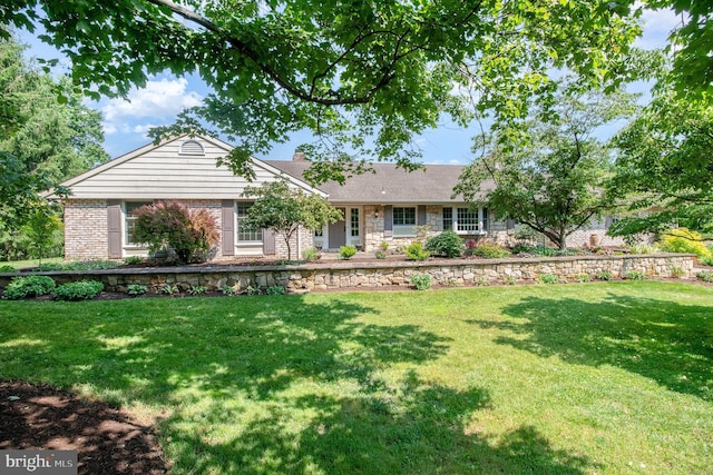 4 Apple Tree Ln, Hummelstown, PA 17036 - ranch-style house featuring a front lawn, a chimney, stone siding, and brick siding