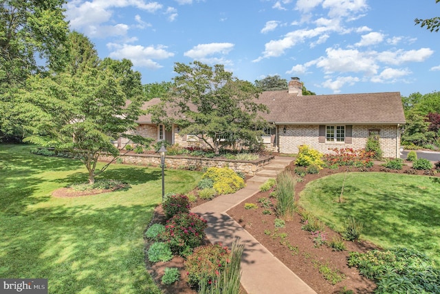 4 Apple Tree Ln, Hummelstown, PA 17036 - view of front of home featuring brick siding, a front lawn, a chimney, and roof with shingles