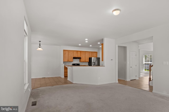 16874 Reef Knot Way, Woodbridge, VA 22191 - unfurnished living room with light tile patterned flooring, light colored carpet, recessed lighting, and baseboards