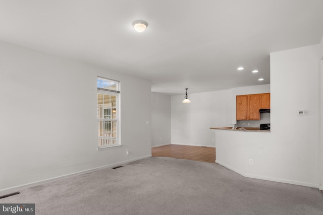16874 Reef Knot Way, Woodbridge, VA 22191 - unfurnished living room featuring recessed lighting, light colored carpet, baseboards, and light tile patterned flooring