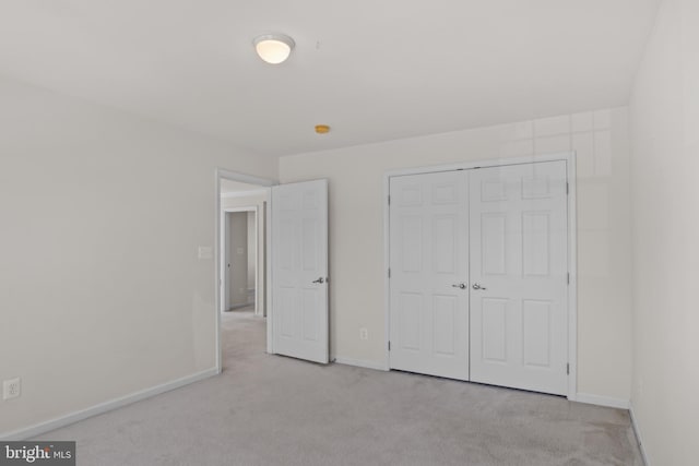 16874 Reef Knot Way, Woodbridge, VA 22191 - unfurnished bedroom with light colored carpet, a closet, and baseboards