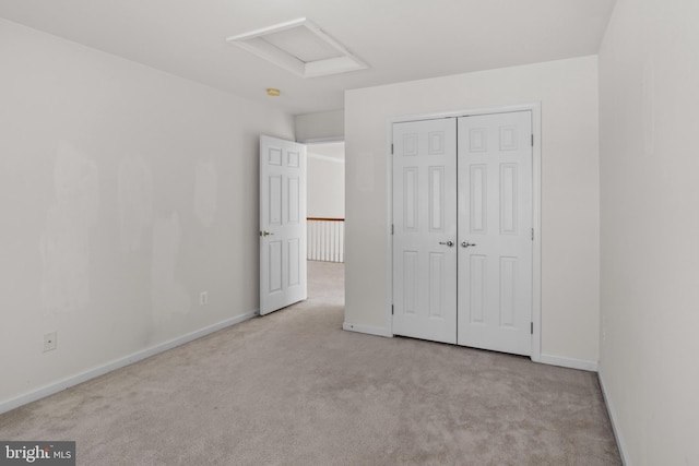 16874 Reef Knot Way, Woodbridge, VA 22191 - unfurnished bedroom featuring attic access, carpet flooring, baseboards, and a closet