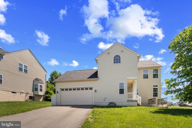 16874 Reef Knot Way, Woodbridge, VA 22191 - rear view of house featuring driveway, an attached garage, a lawn, and roof with shingles