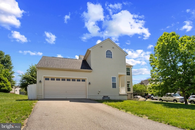 16874 Reef Knot Way, Woodbridge, VA 22191 - view of side of home with driveway, a yard, an attached garage, and roof with shingles