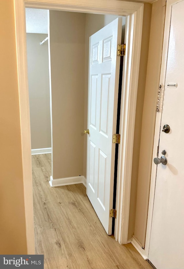 1836 Metzerott Rd Unit 1414, Adelphi, MD 20783 - corridor featuring light wood-style flooring and baseboards