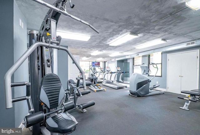 1836 Metzerott Rd Unit 1414, Adelphi, MD 20783 - workout area featuring a textured ceiling