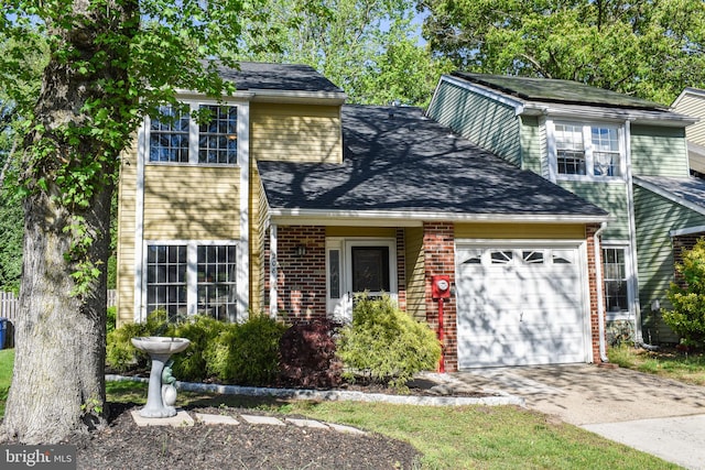 traditional home with an attached garage, driveway, brick siding, and a shingled roof