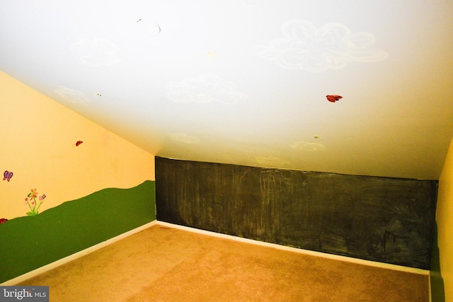 bonus room with carpet, baseboards, and lofted ceiling