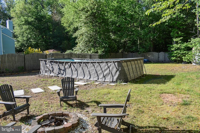 view of yard with an outdoor fire pit
