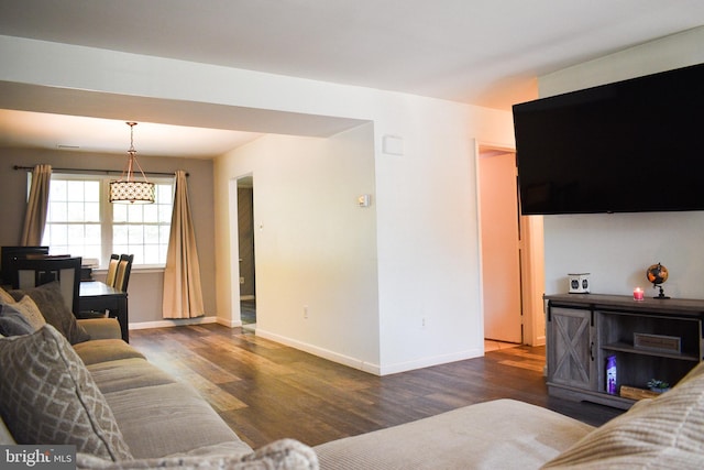 living room featuring wood finished floors and baseboards