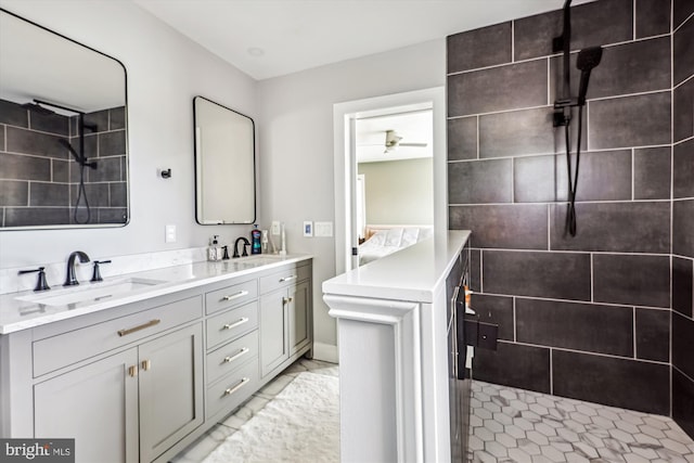 2006 N Bancroft Pkwy, Wilmington, DE 19806 - full bath featuring tiled shower, double vanity, marble finish floors, and a ceiling fan