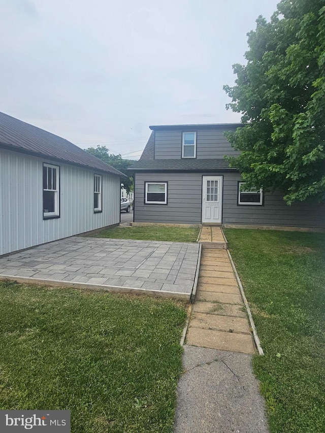 10992 Roxbury Rd, Orrstown, PA 17244 - rear view of house with a lawn and a patio